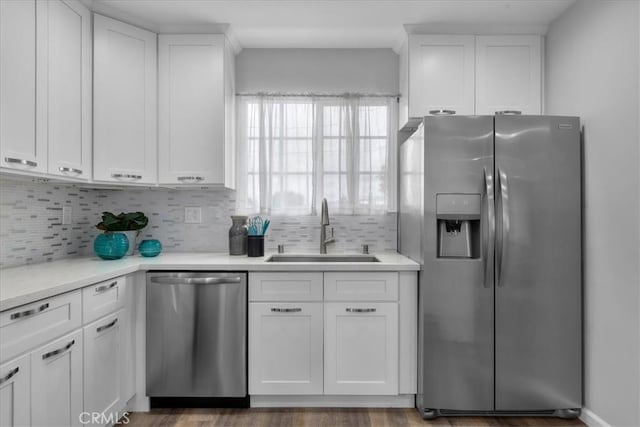 4612 W 161st St, Lawndale, CA 90260 - kitchen featuring stainless steel appliances, a sink, backsplash, and white cabinetry