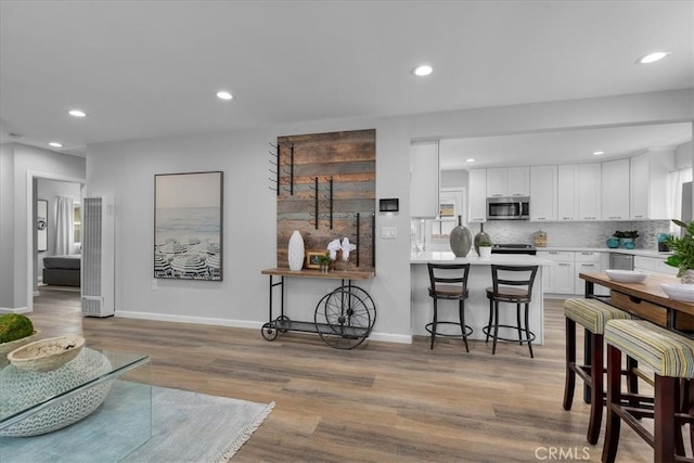 4612 W 161st St, Lawndale, CA 90260 - living room featuring light wood finished floors, recessed lighting, and baseboards