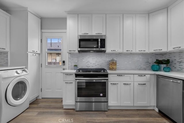 4612 W 161st St, Lawndale, CA 90260 - kitchen featuring washer / clothes dryer, stainless steel appliances, light countertops, and tasteful backsplash