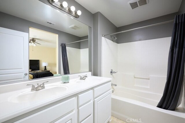 bathroom featuring connected bathroom, a sink, and visible vents