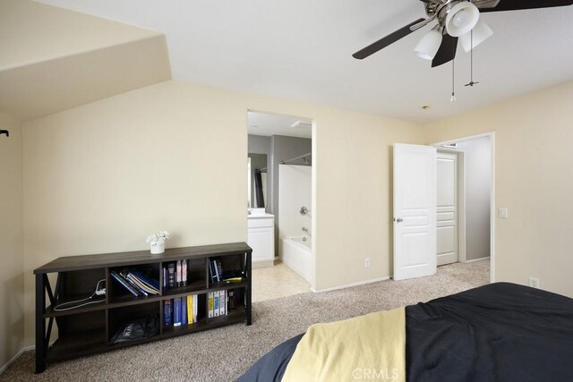 bedroom featuring baseboards, carpet, ceiling fan, and connected bathroom