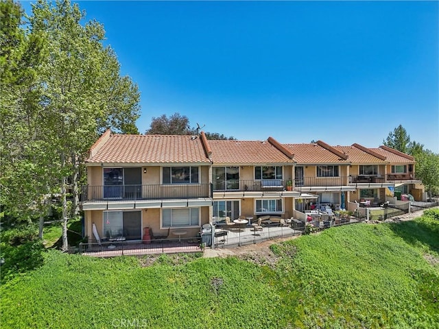 24319 Canyon Lake Dr Unit 10, Canyon Lake, CA 92587 - rear view of house featuring a patio area, a tiled roof, and stucco siding