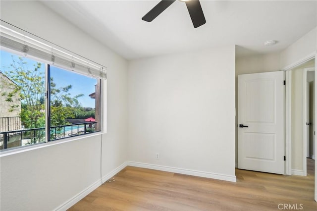 24319 Canyon Lake Dr Unit 10, Canyon Lake, CA 92587 - empty room with light wood-type flooring, baseboards, a wealth of natural light, and ceiling fan
