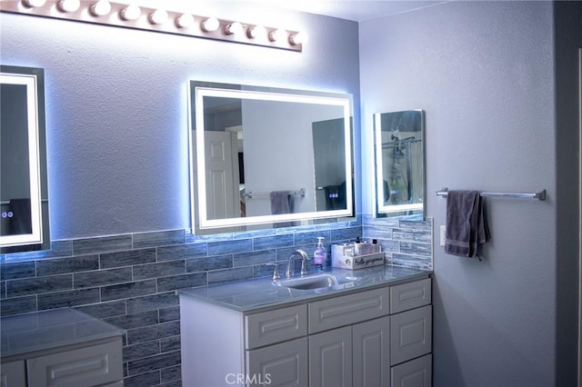 bathroom with vanity and backsplash