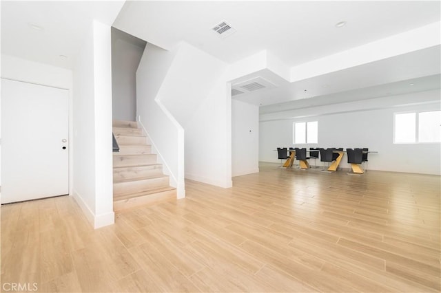 1598 W 36th St, Los Angeles, CA 90018 - interior space featuring light wood finished floors and visible vents