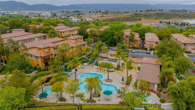 26396 Arboretum Way Unit 2906, Murrieta, CA 92563 - aerial view of residential area with a pool area and a mountain backdrop