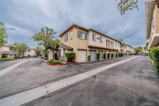 26396 Arboretum Way Unit 2906, Murrieta, CA 92563 - view of asphalt street featuring a residential view and street lights