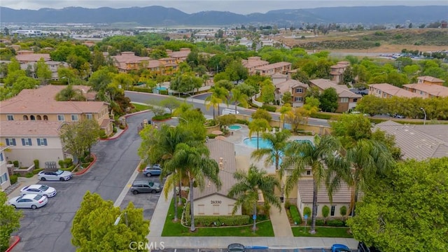26396 Arboretum Way Unit 2906, Murrieta, CA 92563 - aerial perspective of suburban area featuring a mountainous background and a pool area