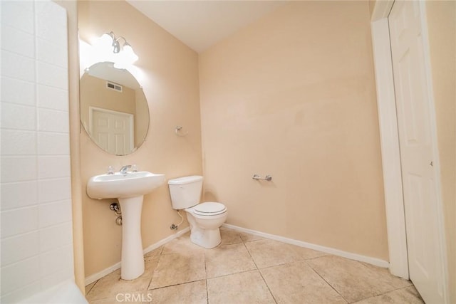 26396 Arboretum Way Unit 2906, Murrieta, CA 92563 - bathroom with toilet, tile patterned floors, baseboards, and a sink