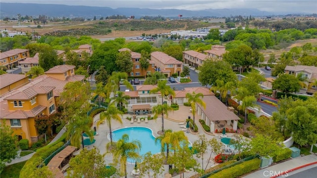 26396 Arboretum Way Unit 2906, Murrieta, CA 92563 - aerial perspective of suburban area featuring a pool and a mountain backdrop