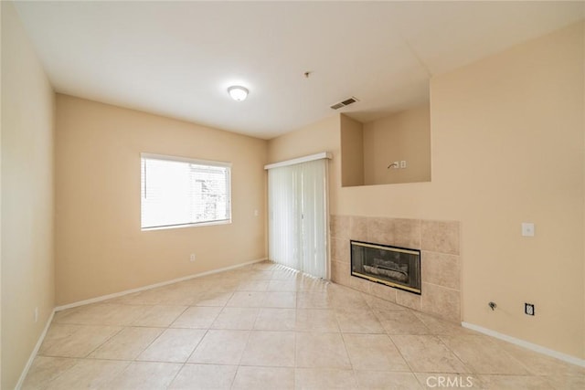 26396 Arboretum Way Unit 2906, Murrieta, CA 92563 - unfurnished living room with a fireplace, baseboards, and light tile patterned floors