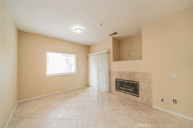 26396 Arboretum Way Unit 2906, Murrieta, CA 92563 - unfurnished living room featuring a fireplace and light tile patterned flooring