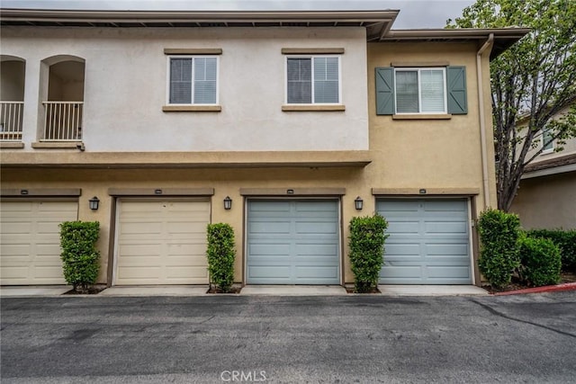 26396 Arboretum Way Unit 2906, Murrieta, CA 92563 - multi unit property featuring stucco siding and a garage