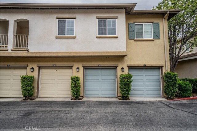 26396 Arboretum Way Unit 2906, Murrieta, CA 92563 - townhome / multi-family property featuring stucco siding and an attached garage