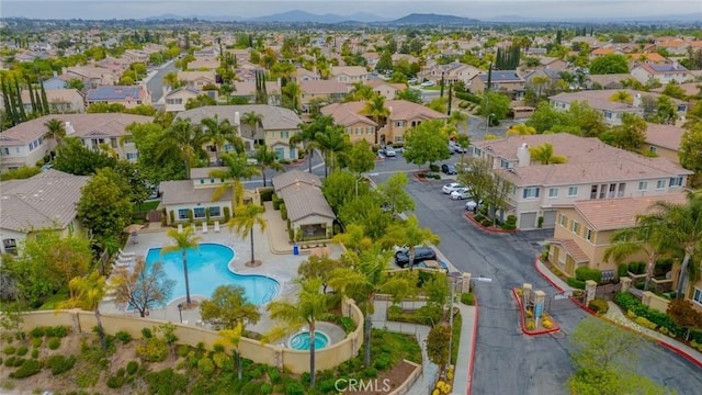 26396 Arboretum Way Unit 2906, Murrieta, CA 92563 - aerial perspective of suburban area featuring a pool and a mountainous background