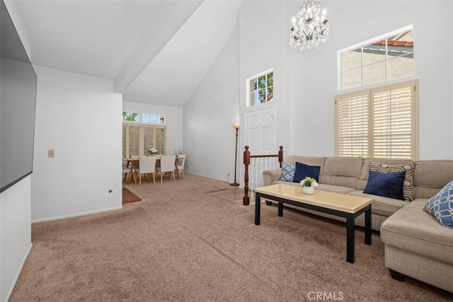 living area with baseboards, carpet flooring, a chandelier, and high vaulted ceiling