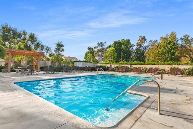 pool with fence, a patio, and a pergola