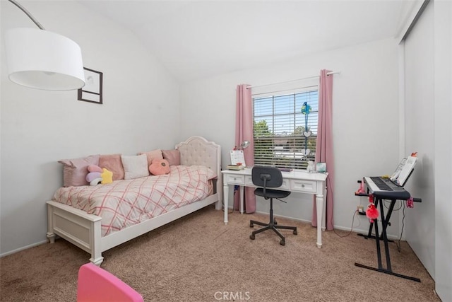 carpeted bedroom with vaulted ceiling