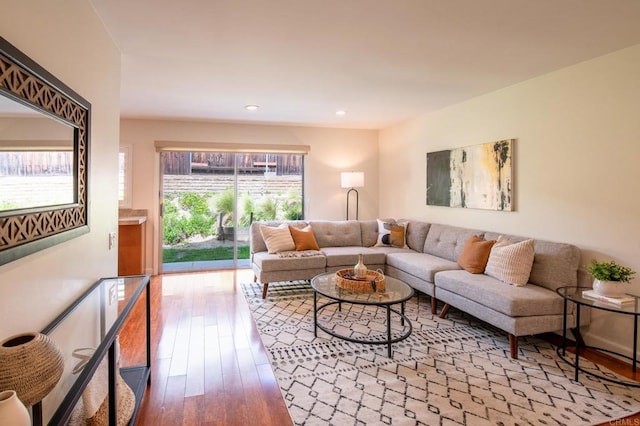 living room with hardwood / wood-style flooring and recessed lighting