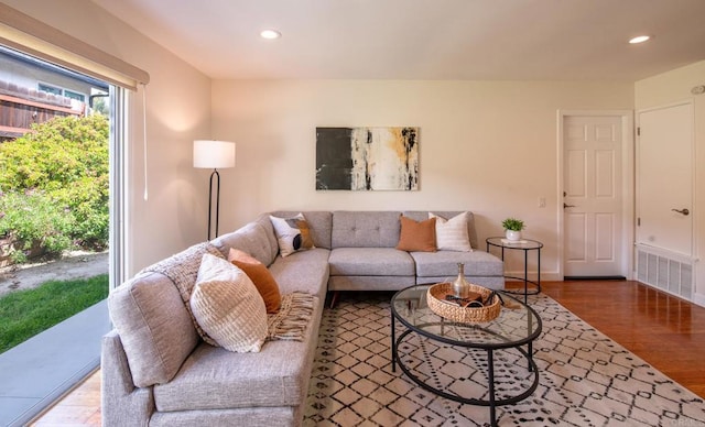living room with wood finished floors and recessed lighting