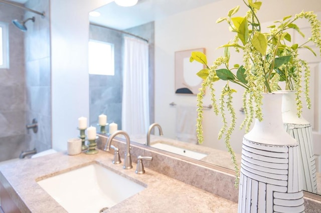 bathroom with vanity and a shower with shower curtain