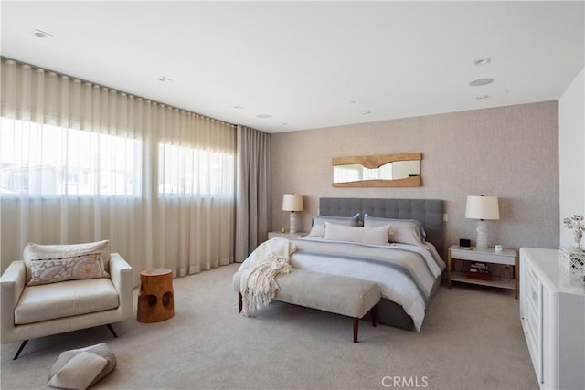 bedroom featuring light colored carpet