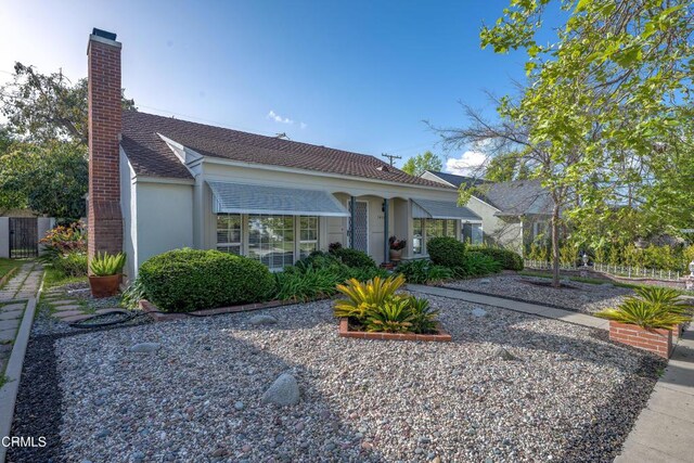 1404 Sycamore Ave, Glendale, CA 91201 - view of front of home featuring a chimney and stucco siding
