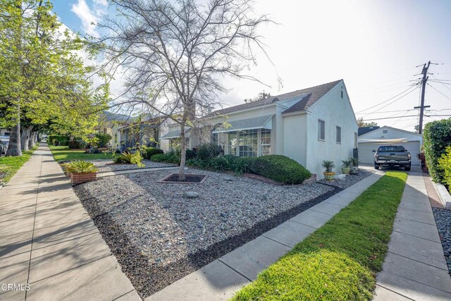 1404 Sycamore Ave, Glendale, CA 91201 - view of property exterior featuring an outbuilding, stucco siding, and a shingled roof