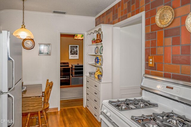 1404 Sycamore Ave, Glendale, CA 91201 - kitchen featuring white appliances, ornamental molding, wood finished floors, decorative light fixtures, and open shelves