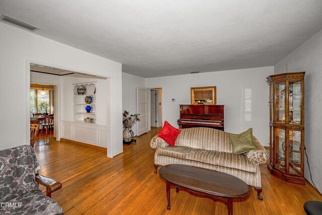 1404 Sycamore Ave, Glendale, CA 91201 - living area with wood finished floors and built in shelves