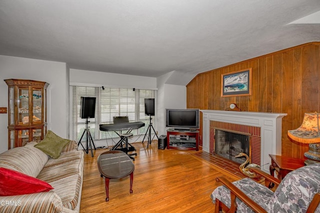 1404 Sycamore Ave, Glendale, CA 91201 - living room featuring wood finished floors, a fireplace, and wood walls