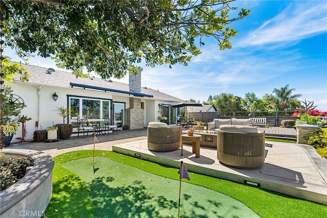 exterior space featuring fence and an outdoor living space