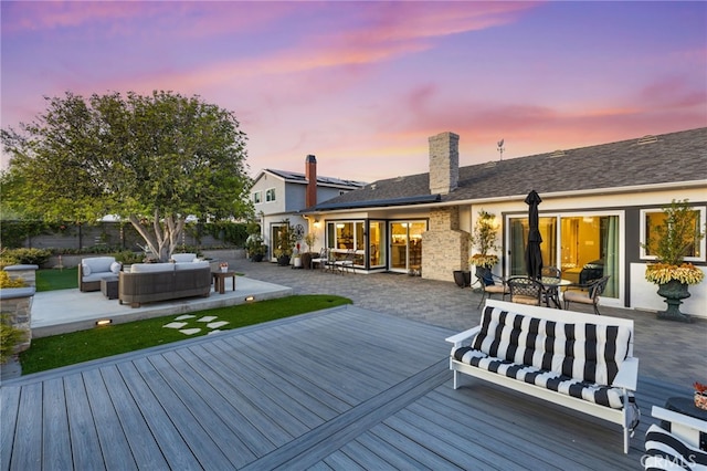 wooden terrace with an outdoor hangout area, outdoor dining area, and fence