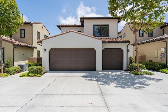 6784 Kenmar Way, San Diego, CA 92130 - mediterranean / spanish house with an attached garage, driveway, a tile roof, and stucco siding