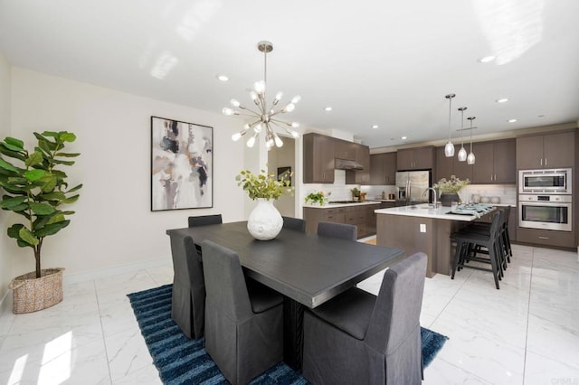 6784 Kenmar Way, San Diego, CA 92130 - dining space featuring light marble finish floors, recessed lighting, and a chandelier