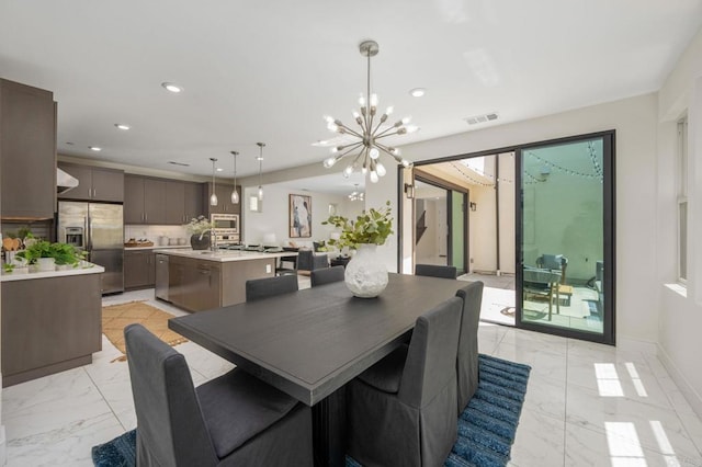 6784 Kenmar Way, San Diego, CA 92130 - dining room with light marble finish floors, a chandelier, and recessed lighting