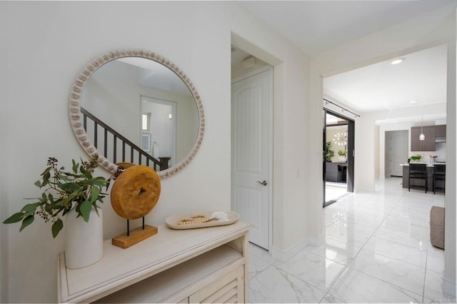 6784 Kenmar Way, San Diego, CA 92130 - hall featuring light marble finish floors, stairs, and recessed lighting