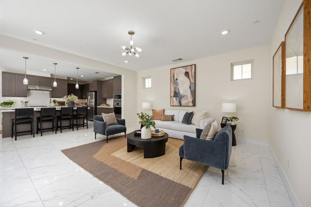 6784 Kenmar Way, San Diego, CA 92130 - living room with light marble finish floors, a chandelier, and recessed lighting