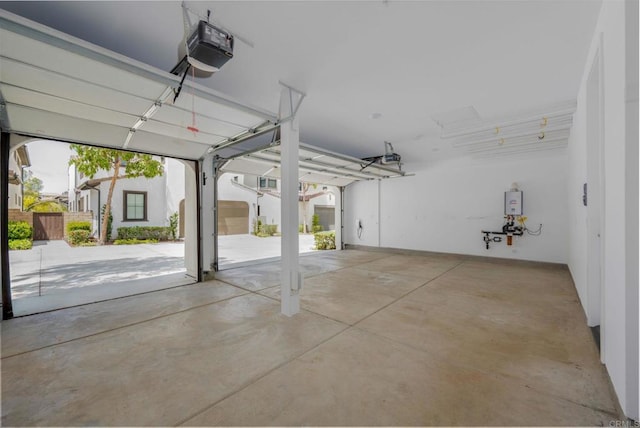 6784 Kenmar Way, San Diego, CA 92130 - garage featuring a garage door opener and water heater
