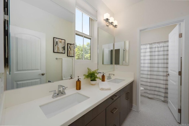 6784 Kenmar Way, San Diego, CA 92130 - full bath featuring double vanity, tile patterned floors, and a shower with curtain