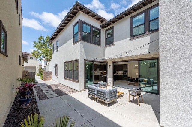 6784 Kenmar Way, San Diego, CA 92130 - back of property with stucco siding, a patio, and outdoor lounge area