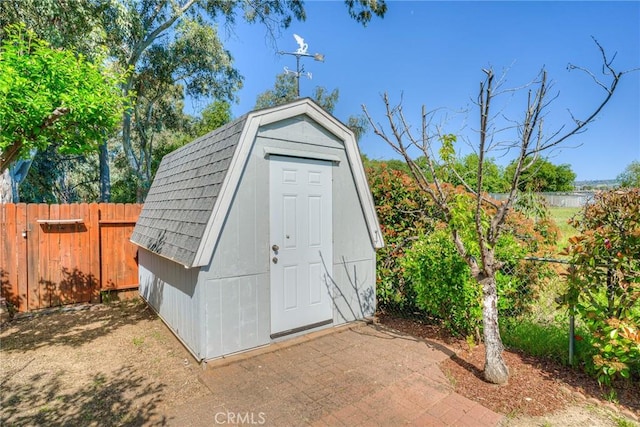 view of shed with fence