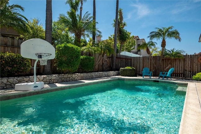 view of swimming pool with a fenced in pool and a fenced backyard