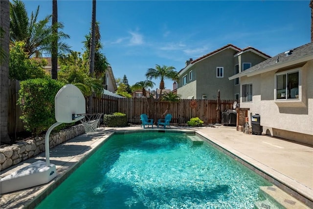 view of pool with a fenced backyard, a fenced in pool, and a patio area