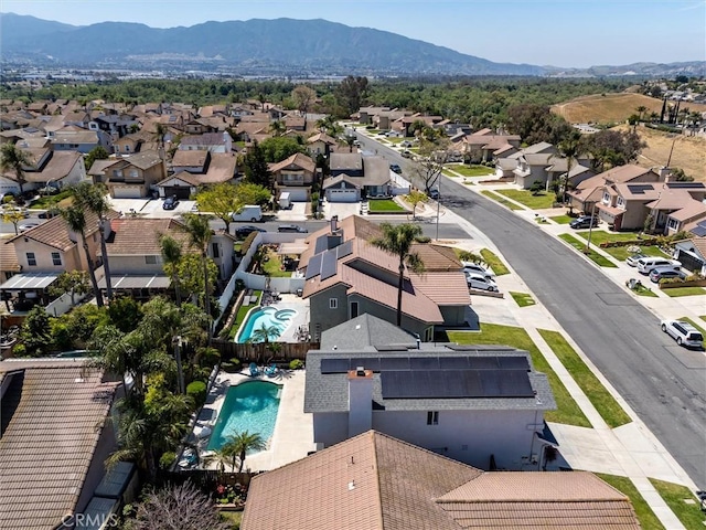 birds eye view of property featuring a mountain view and a residential view