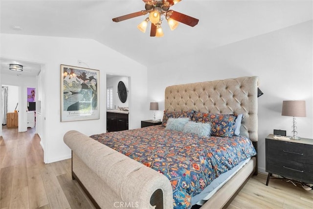 bedroom featuring baseboards, wood finished floors, a ceiling fan, and vaulted ceiling