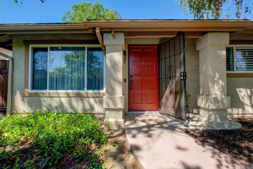 property entrance with stucco siding