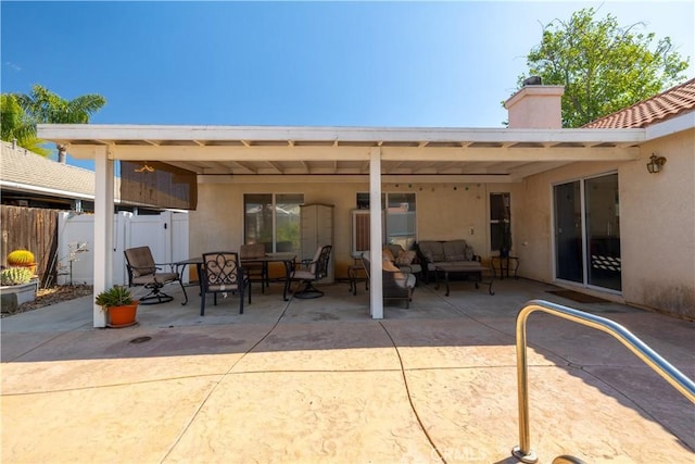 25714 Sunnyvale Ct, Menifee, CA 92584 - back of property featuring fence, a patio, a chimney, and outdoor lounge area