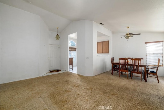 25714 Sunnyvale Ct, Menifee, CA 92584 - dining area with ceiling fan, light carpet, vaulted ceiling, and a wealth of natural light