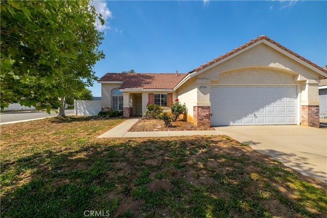 25714 Sunnyvale Ct, Menifee, CA 92584 - view of front of property featuring concrete driveway, a tiled roof, a garage, and stucco siding